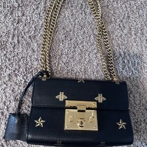 Gucci Elegant Black Crossbody Bag with Gold Accents